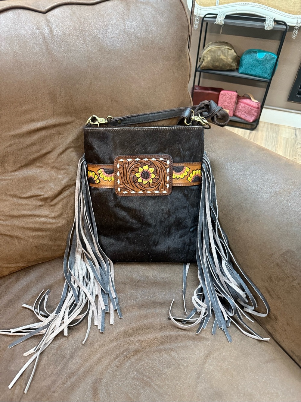 Women's Black Fringe Crossbody Bag with Floral Tooled Accent and Brown Trim